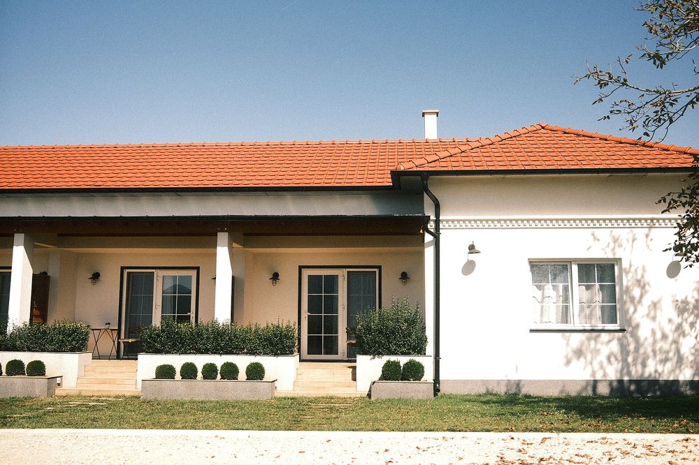 Finished single-storey house with a tiled roof and garden